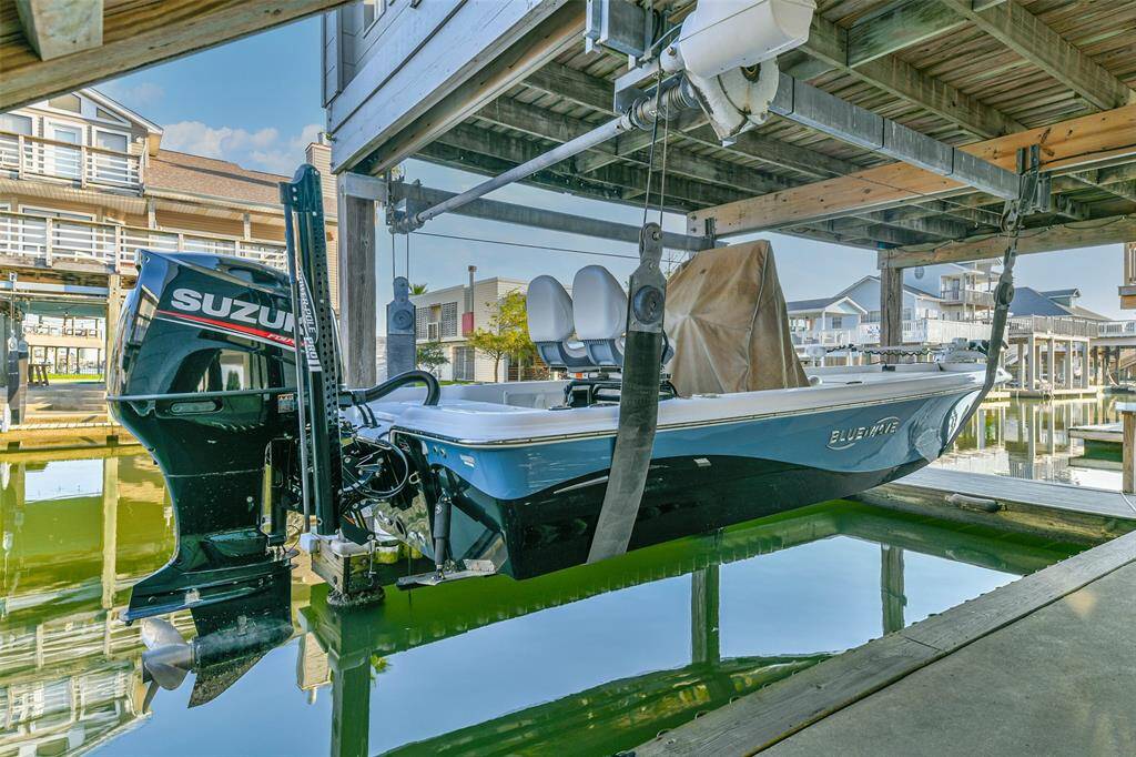 A boat lift on the canal provides convenient access to the bay.