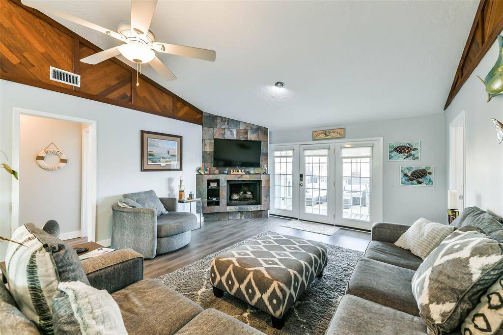 Wood accents adorn the walls of the family room, adding warmth and character to the space.