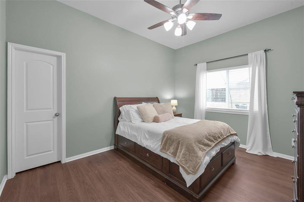 The second of three additional bedrooms. All the bedrooms have fresh neutral wall paint.