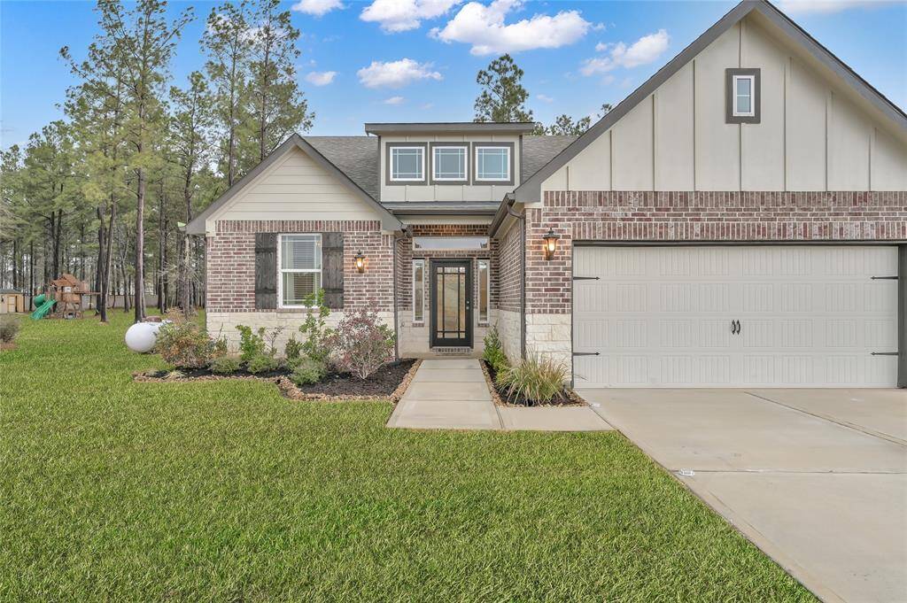Charming home with great curb appeal, an extended driveway, and a three-car garage in a serene setting.