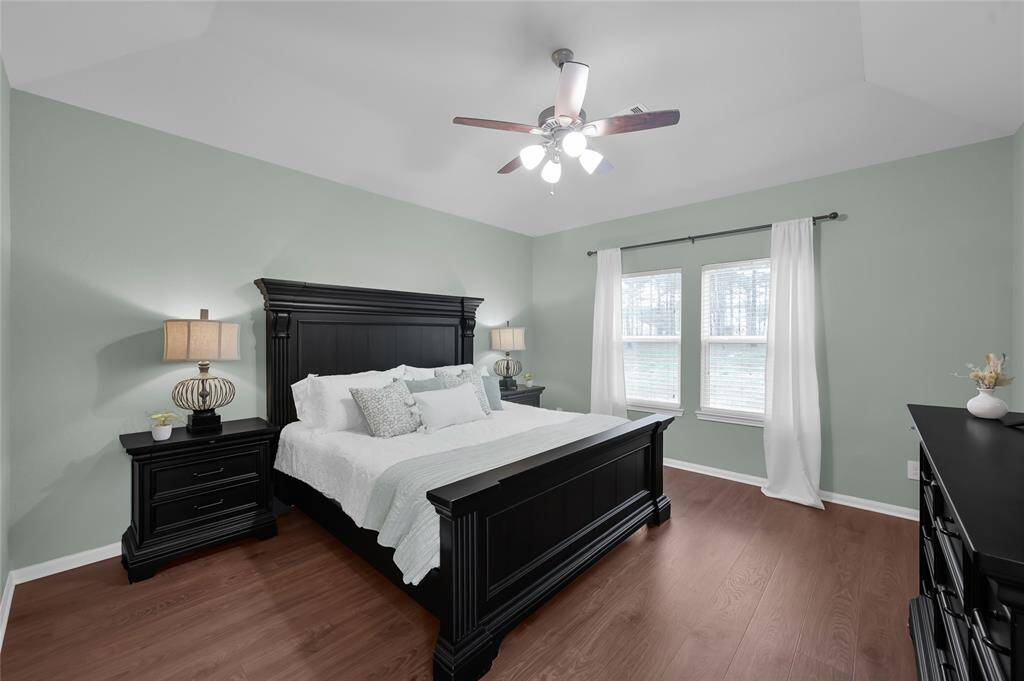 The spacious primary bedroom with double windows allow for lots of natural light and a great view of the backyard. You also have a walk-in closet.