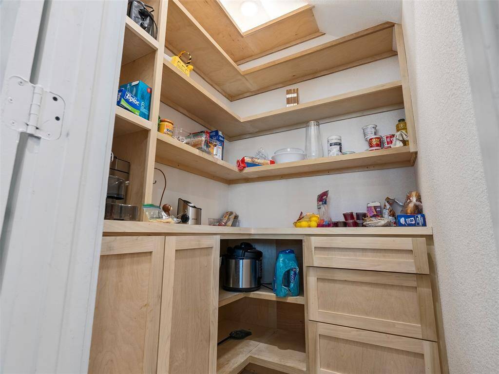 Kitchen pantry with custom cabinets and shelves