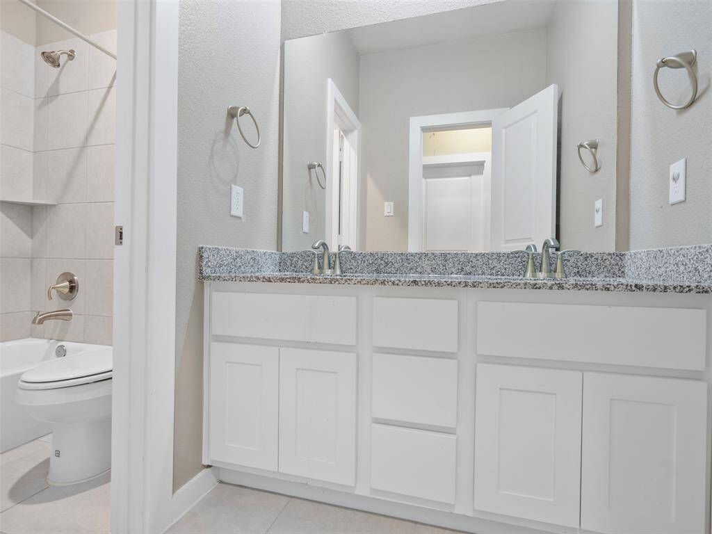 4th full bathroom with separated sink vanity and toilet/shower