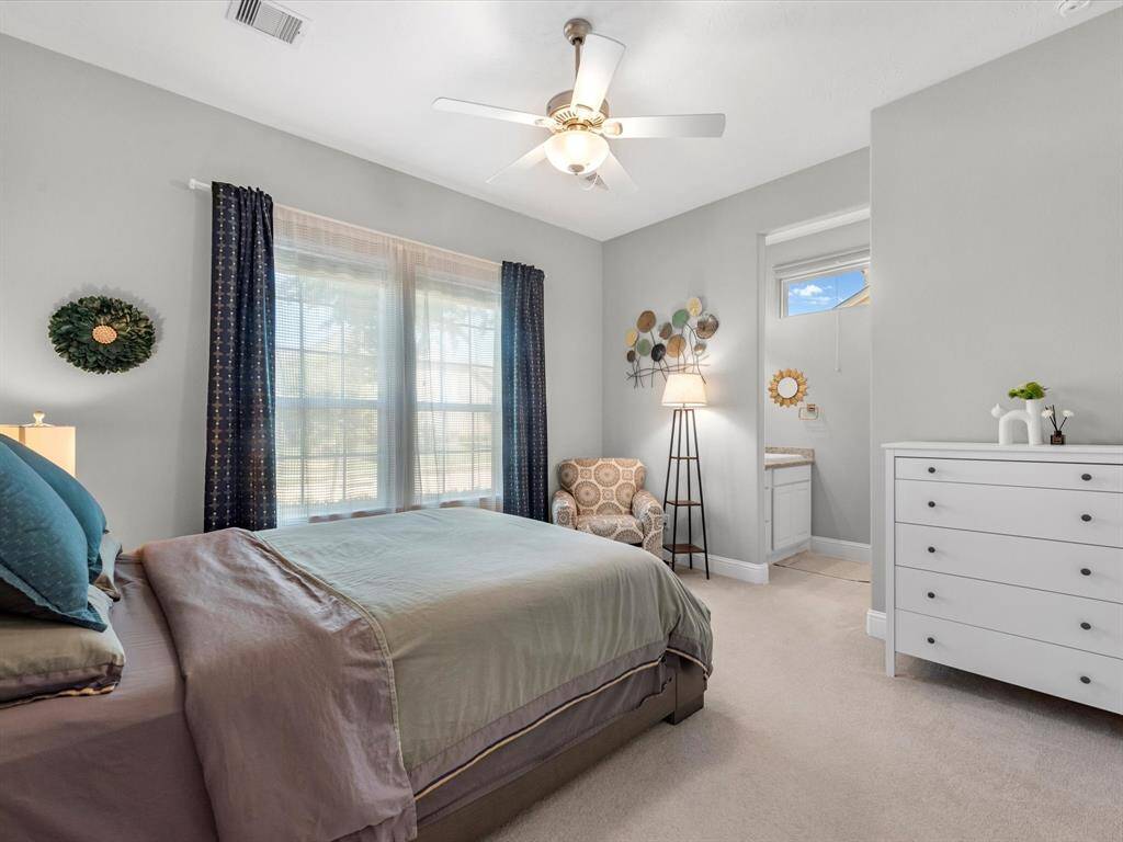 Spacious secondary bedroom #2 in the front of the home share a jack and jill bathroom!