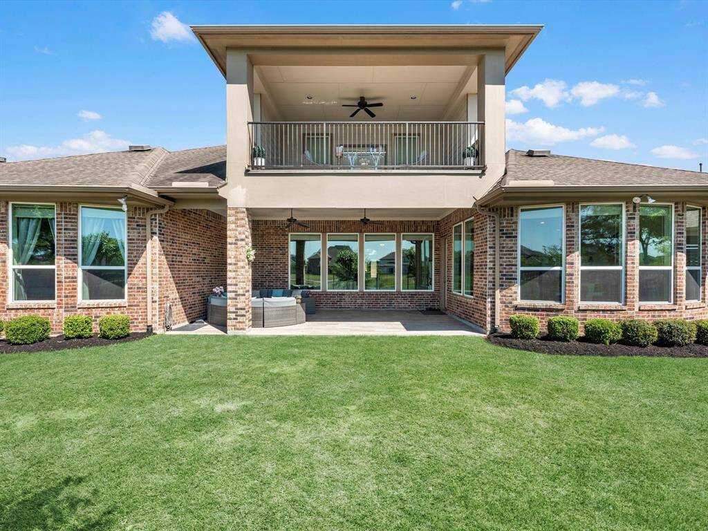 Gorgeous backyard offers views to the lake and spacious covered patio!
