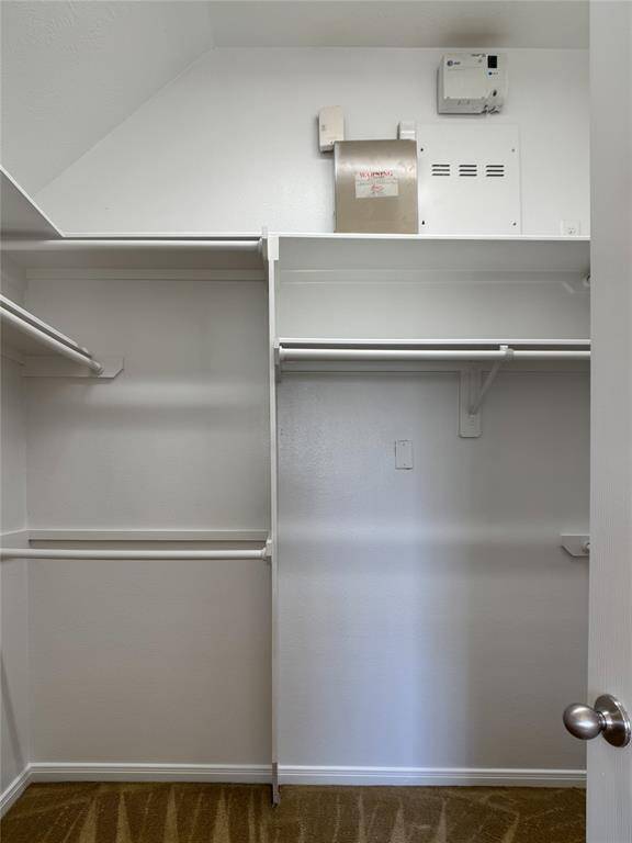spacious primary walk-in closet