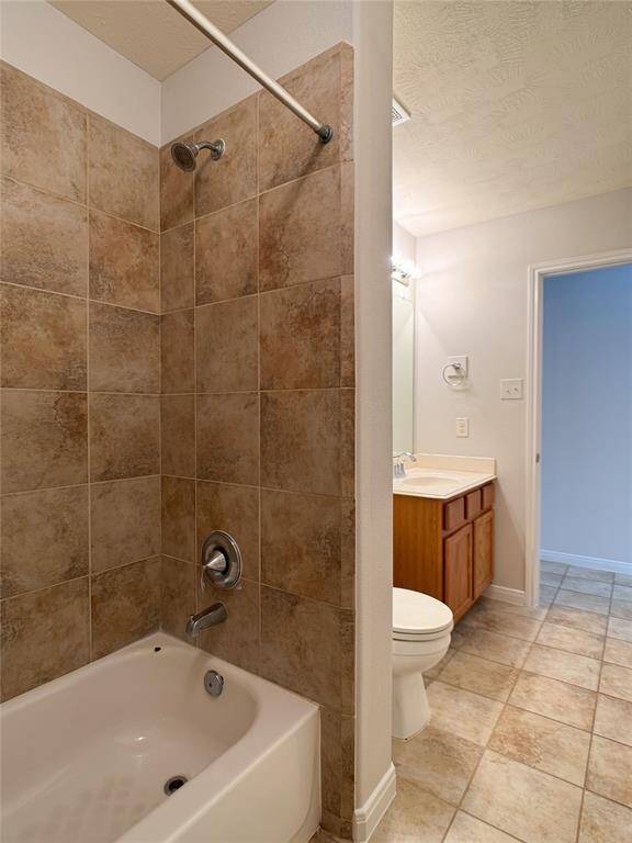 beautiful tile flooring & tub/shower surround