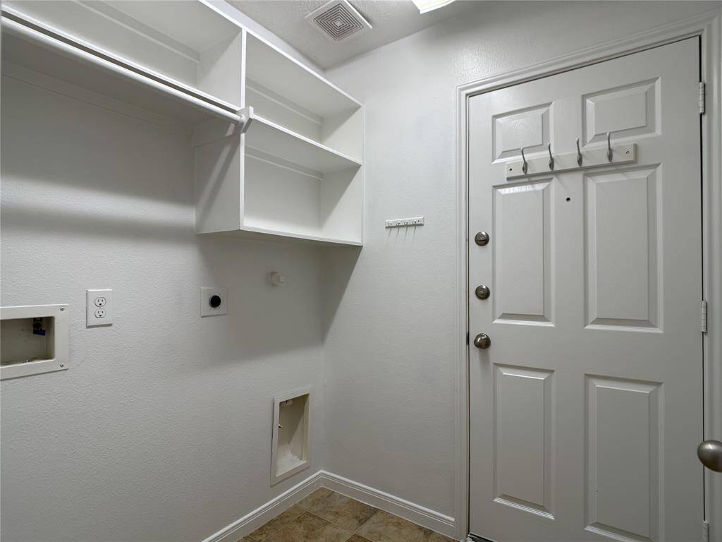 laundry room w/electric & gas dryer connections, washer connections, door to 2-car garage
