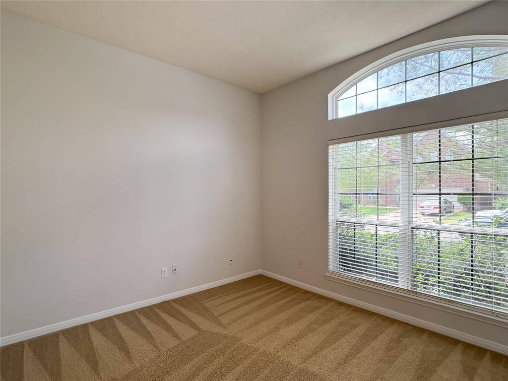study/home office/bonus-flex room with view of the lush front yard