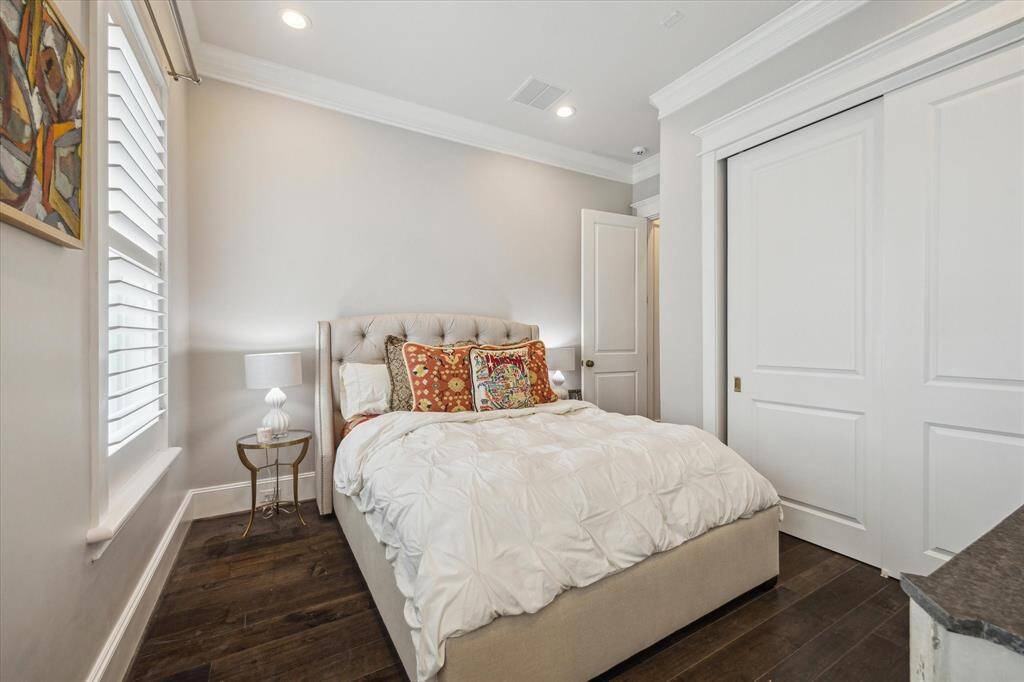 Second bedroom features beautiful hardwood floors and abundance of natural light.