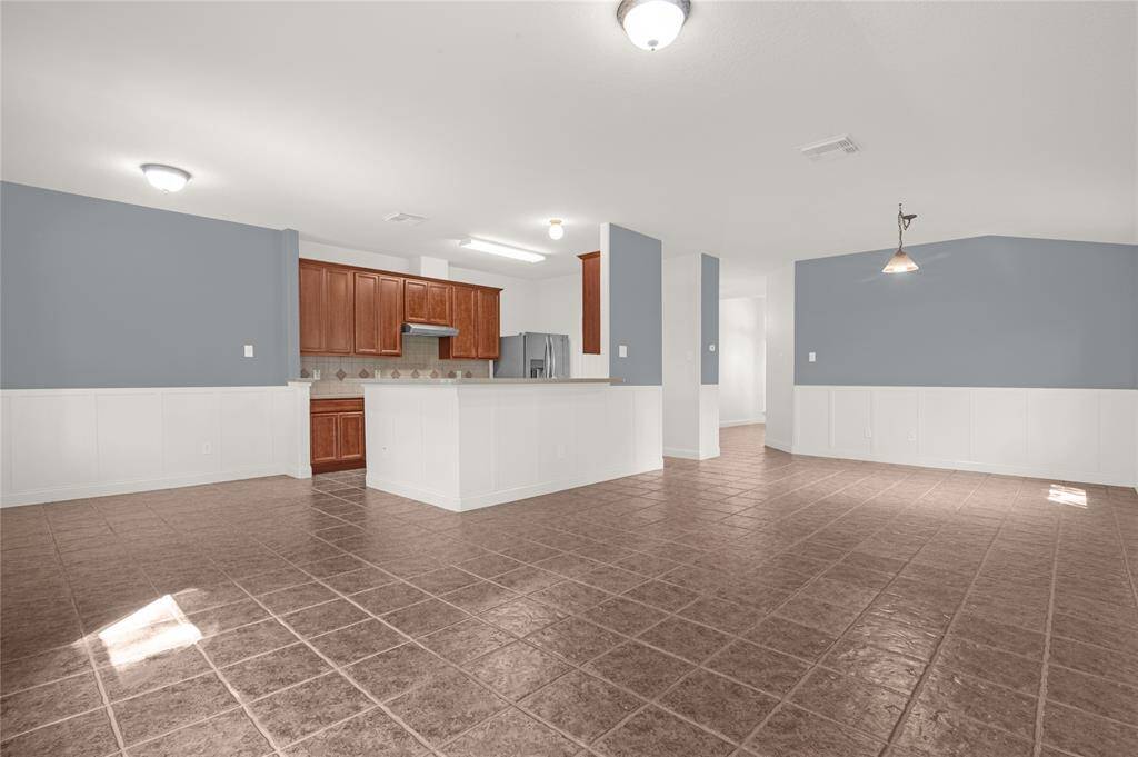 Breakfast bar and dining room open to the living room.