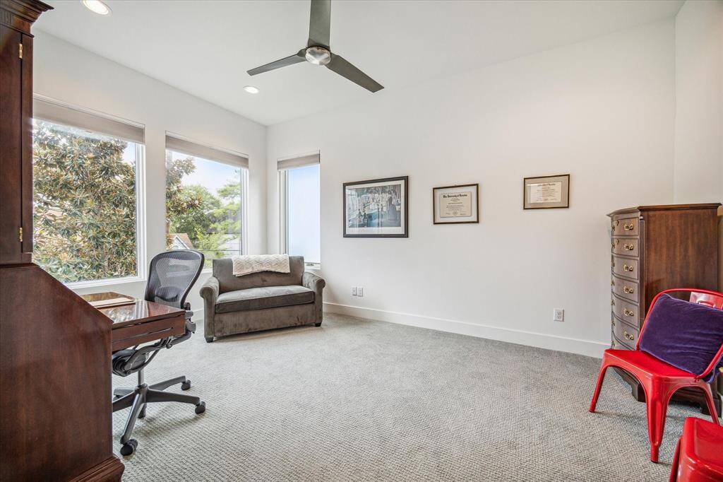 Secondary bedroom with carpet, recessed lighting and ceiling fan.