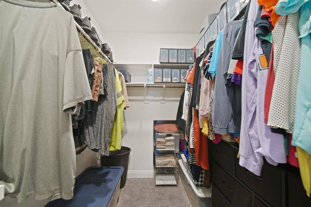 Honey... this isn’t a closet. This is a *runway*. You’ve got hanging space, shelf space, and probably enough room to hide your online shopping secrets. Shoes finally get the love they deserve.