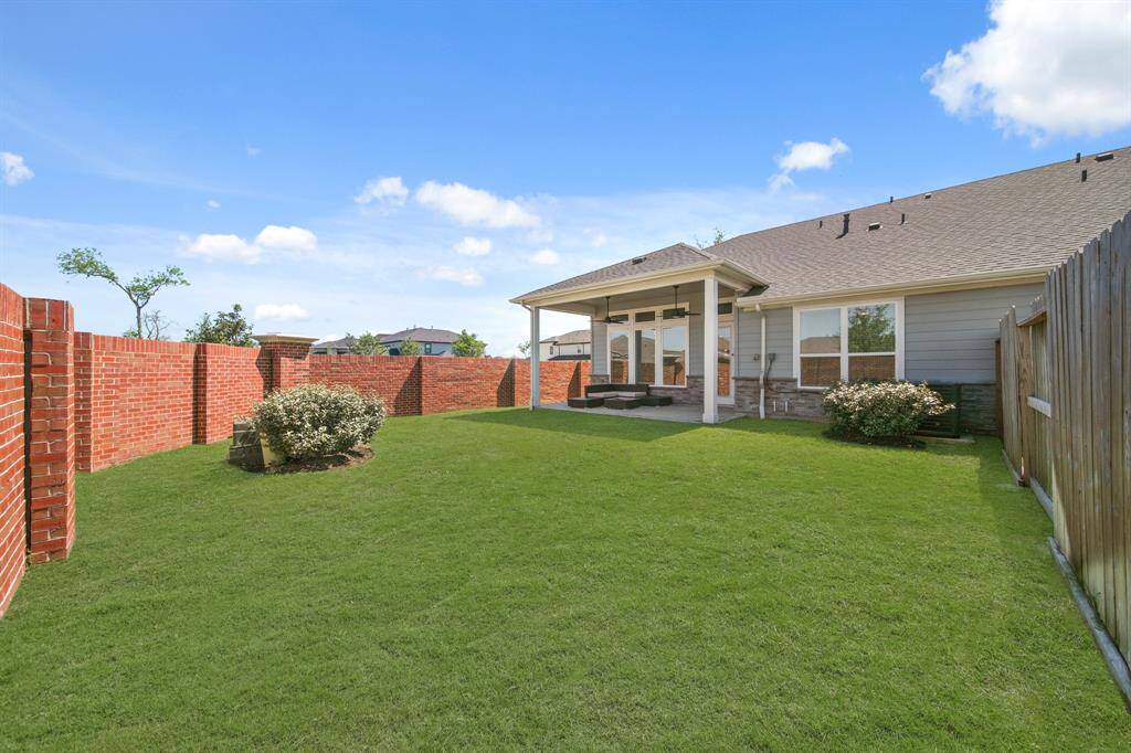 From corner to corner, this backyard’s got space for lawn games, birthday parties, or that hammock you keep forgetting to buy. And thanks to the full brick fence, it’s all yours, no peeking neighbors allowed.