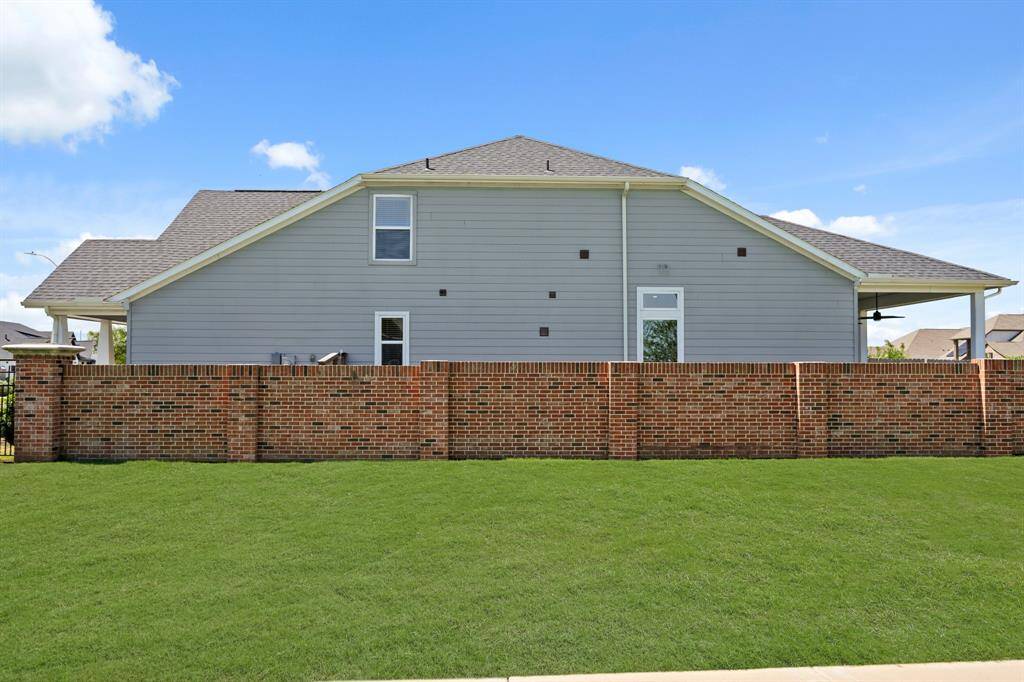 Not only is it private — it’s also extra. That brick fence? It's not just fancy. It’s functional and fabulous. You get a tucked-away vibe with *plenty* of space for whatever makes your outdoor heart happy.