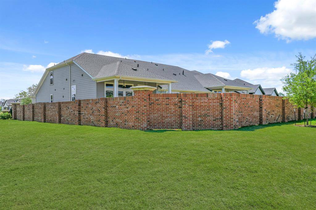 Zoom in on that full brick finish. It wraps around like a designer belt for your whole backyard. You’re about to level up your patio life, and this privacy wall is the accessory that seals the deal.