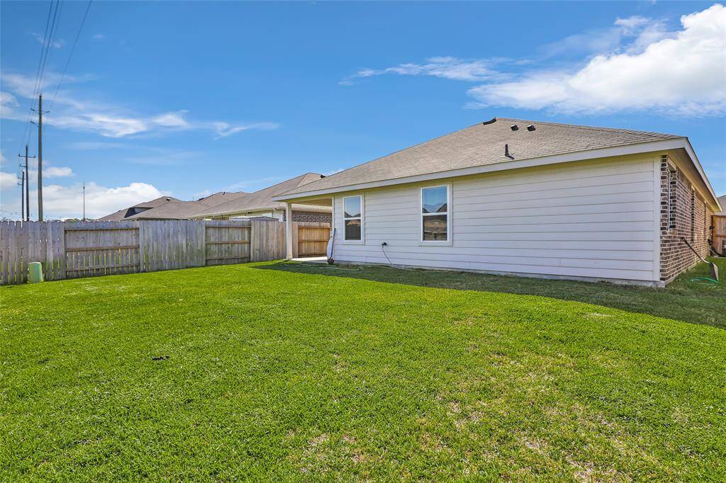 Spacious yard with space to add storage, trees or landscaping.