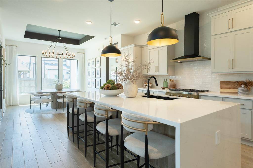 Every chef and entertainer will delight in this stunning kitchen, boasting a spacious island, stylish cabinetry, and top-of-the-line appliances.  Entertain in style and enjoy the heart of your home!