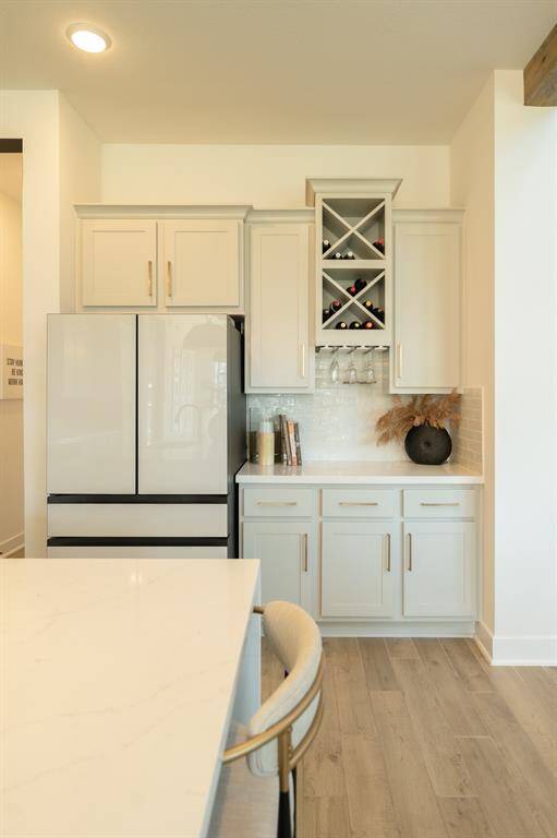 This versatile space is perfect as a wine bar—or easily styled as a charming coffee station, tailored to your taste. Designer detail - wine and stemware storage
