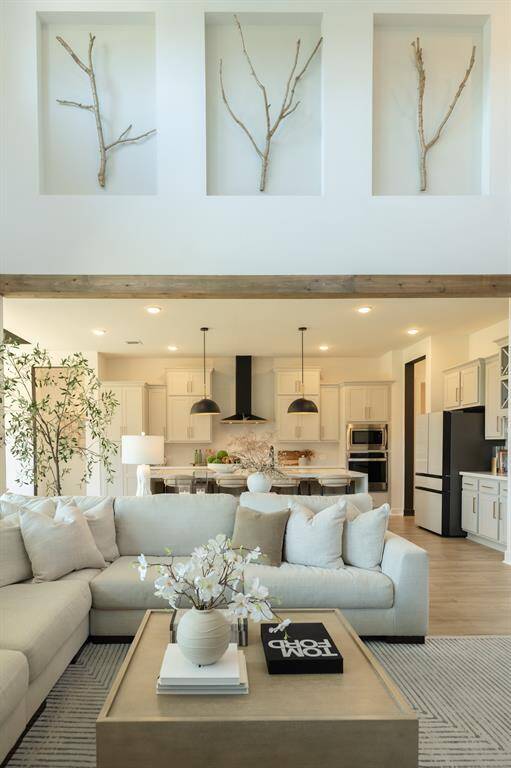 Beams and exquisite decorative nooks add the perfect finishing touches to this professionally designed home, elevating its timeless charm.