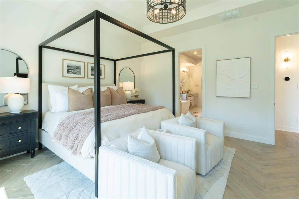 Upgraded lighting and exquisite flooring make this primary suite a space you'll never want to leave.