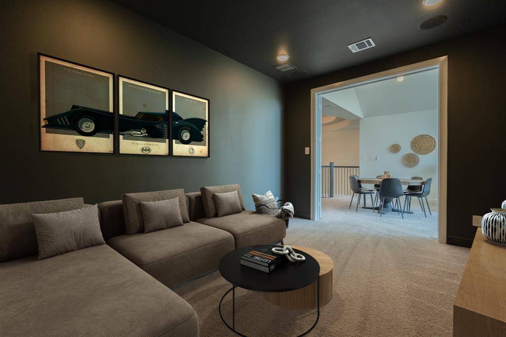 The dedicated media room offers a cozy, tucked-away space—perfect for movie nights, gaming, or relaxing with your favorite series.(digitally staged) Designer detail - custom paint