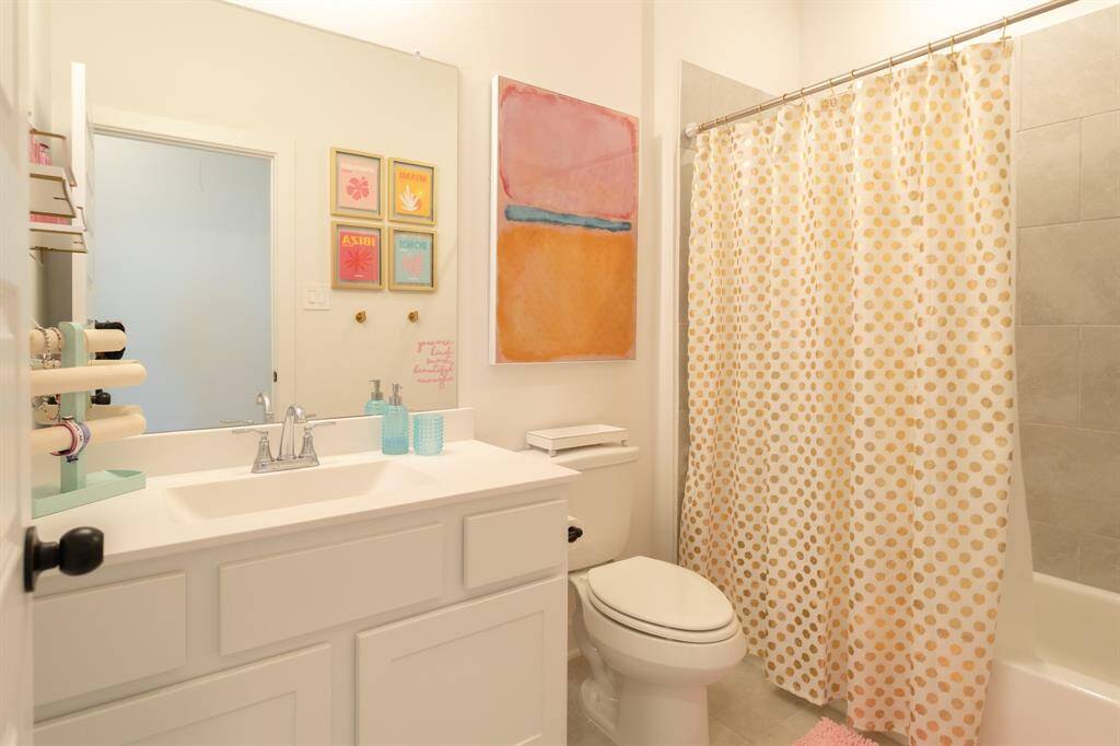 A full bathroom is conveniently located off the upstairs hallway, providing easy access for guests.