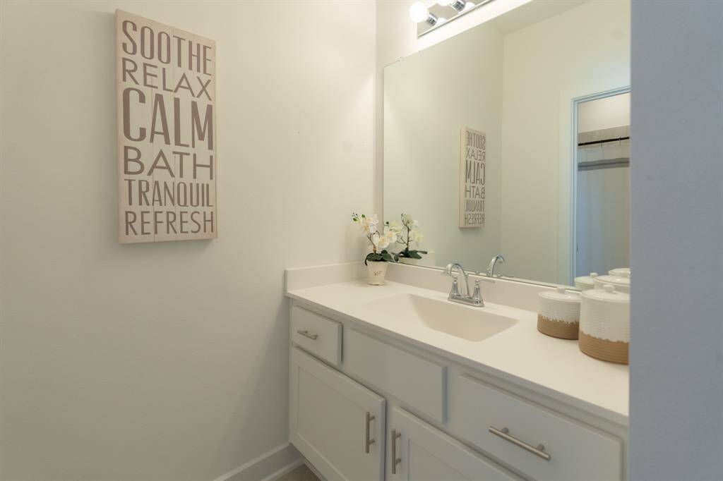 The bedroom is connected to a shared Jack and Jill bathroom, offering both convenience and privacy with separate vanity and wet areas.