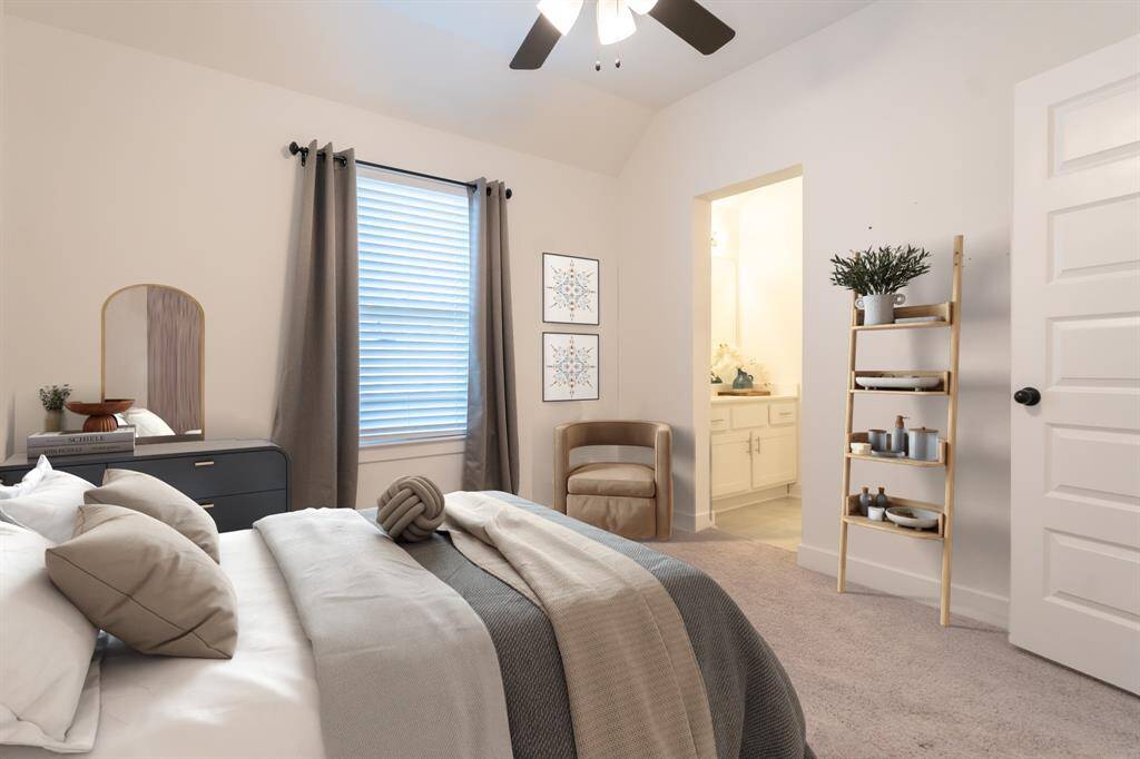 This secondary bedroom features a calming palette of soft neutrals and Jack and Jill bath access. (Digitally staged)