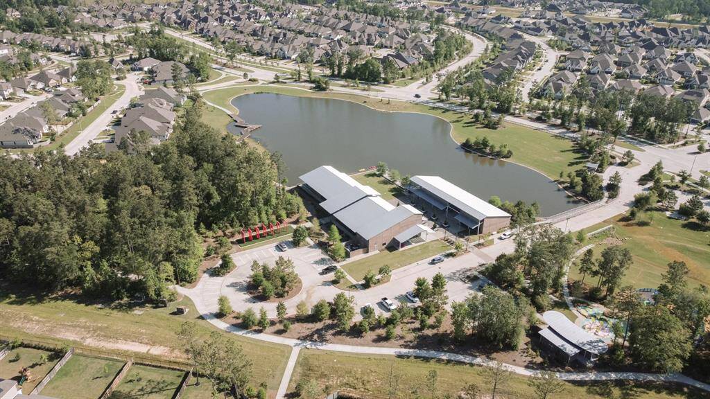 Residents of Artavia enjoy the sparkling five-acre lake, complete with walking trails, paddleboard access, and scenic spots to relax