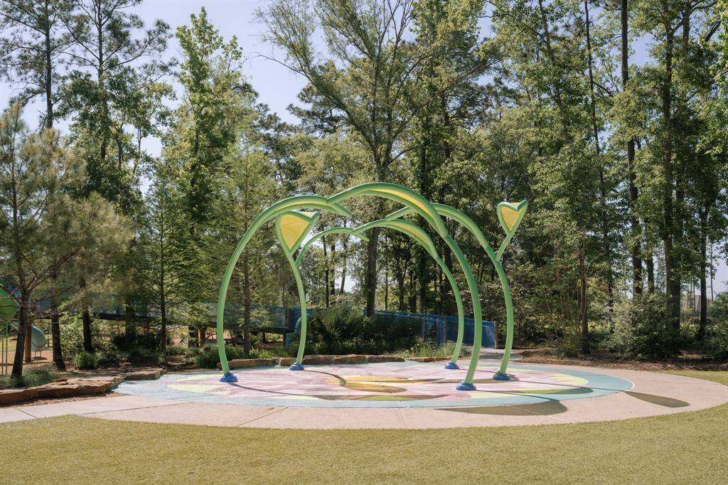 Families will love the vibrant playground and splash pad area, offering safe, interactive fun for little ones just steps from home.