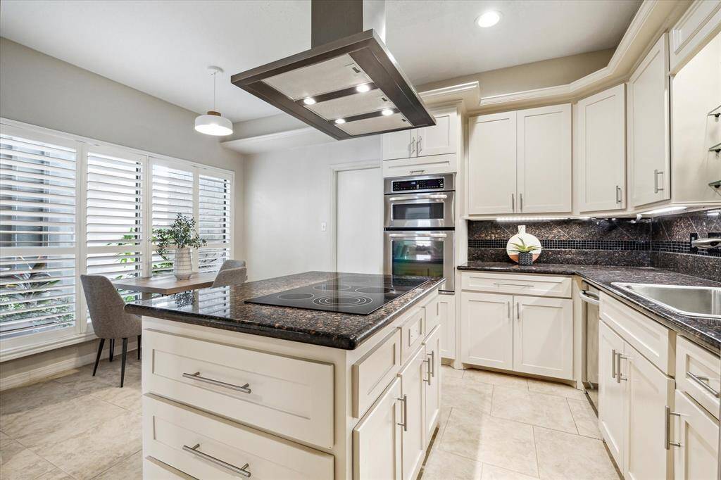 Tons of cabinet space including a pantry.   Access to the garage through the kitchen.