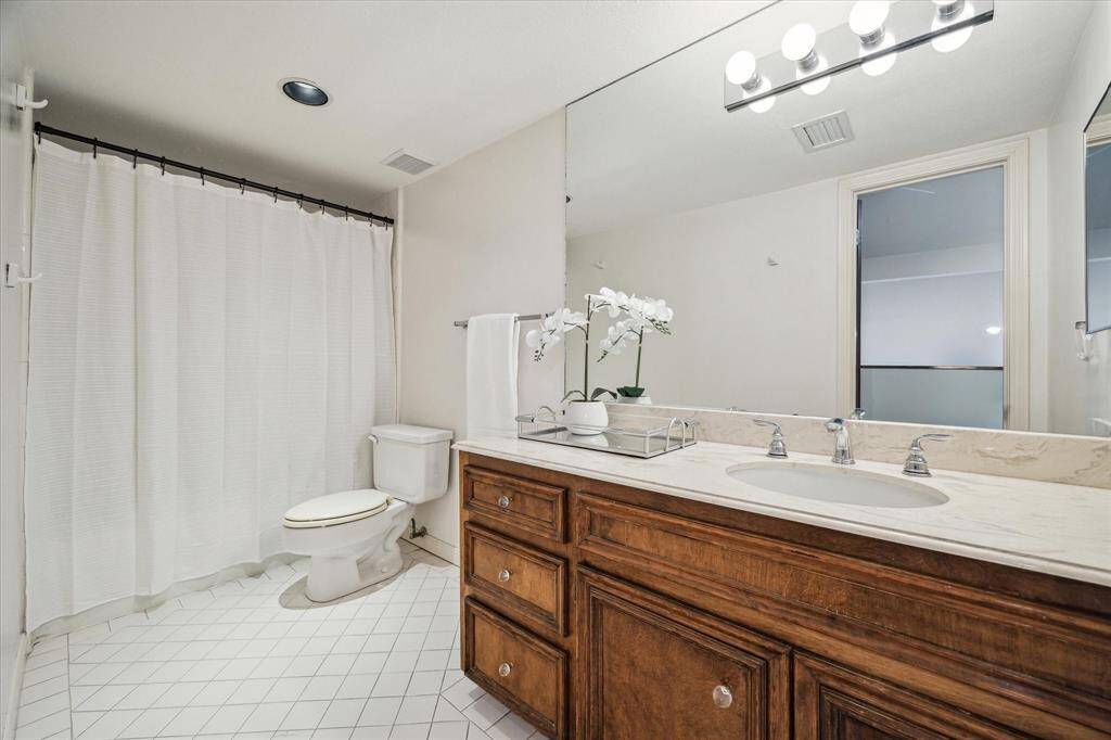 BATHROOM THREE.  Used by the third floor bedroom.   With walk in shower.
