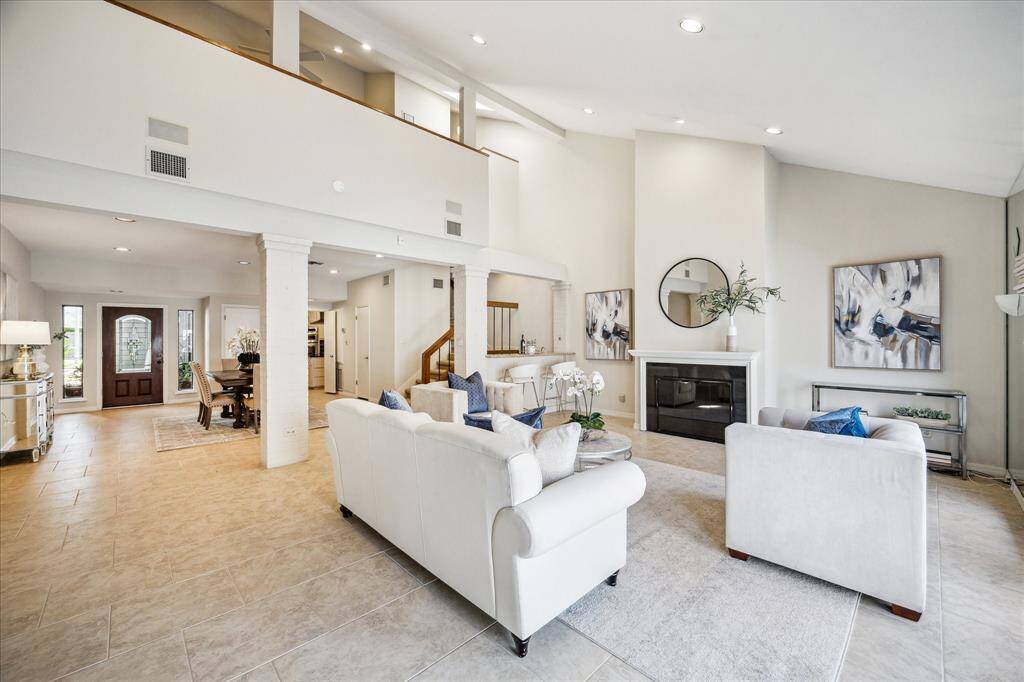 A view taking in the high ceilings with the loft area on the left.