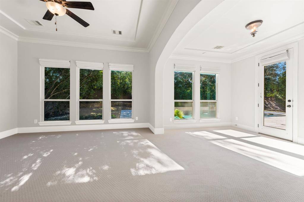 The primary suite enjoys recently updated flooring.