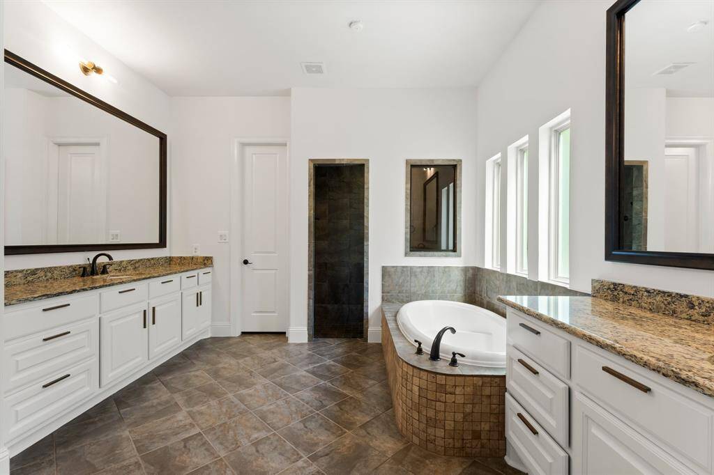 The primary bath features recently refreshed cabinets and great drawer space!