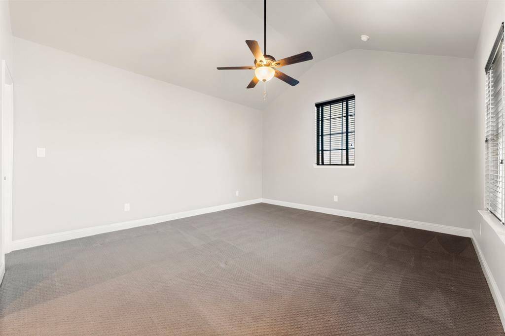 Vaulted ceilings in this oversized secondary bedroom.