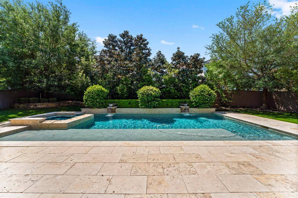 Simple yet elegant backyard with mature landscape and enhanced with luxurious and convenient turf just installed April of 2025!