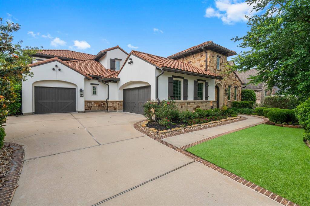 3 Car Garage with Cedar Garage Doors.