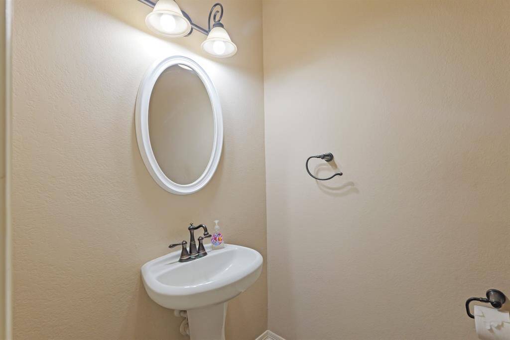 This well-appointed half bathroom is great for when you have family, friends, and guests over.