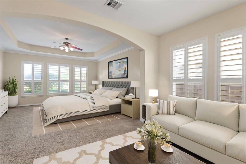 Virtually Staged: Unwind after a long day in this incredibly spacious Primary bedroom! It features its very own private sitting room, windows with shutters, and carpet floors.