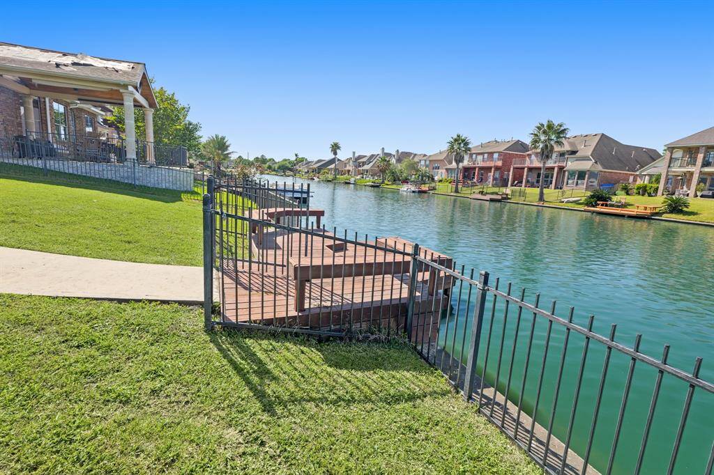 The boat dock has a fence around it for more safety.