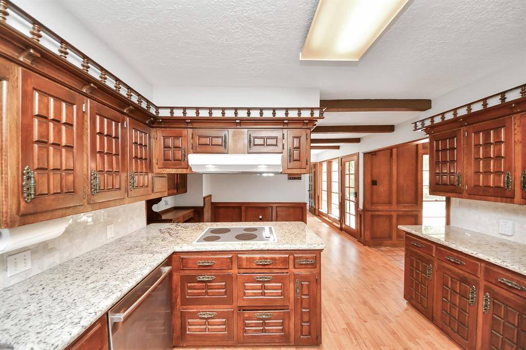 With plenty of drawers and cabinets for storage and an electric glass cooktop, the kitchen is well-equipped and ready for the cook of the family.