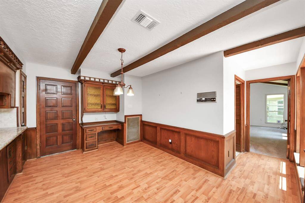 Located just off the kitchen down a small corridor, you will find the laundry room followed by the private owner's suite.