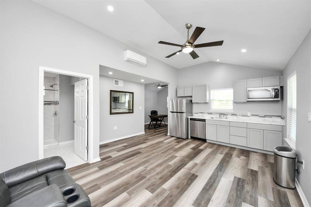 Modern in every aspect, this guesthouse serves as a versatile space for additional living, perfect for guests, a home office, or a private retreat.