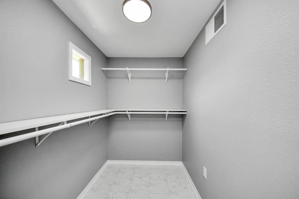 This guest home even includes a huge walk-in storage closet, perfect for personal belongings or overflow items from the main house, adding incredible convenience and versatility.