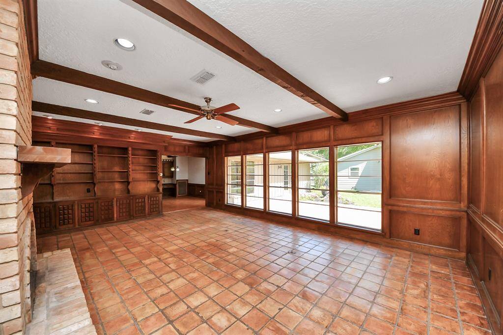 Adjacent to the den, the kitchen and breakfast room create an ideal setup for entertaining.