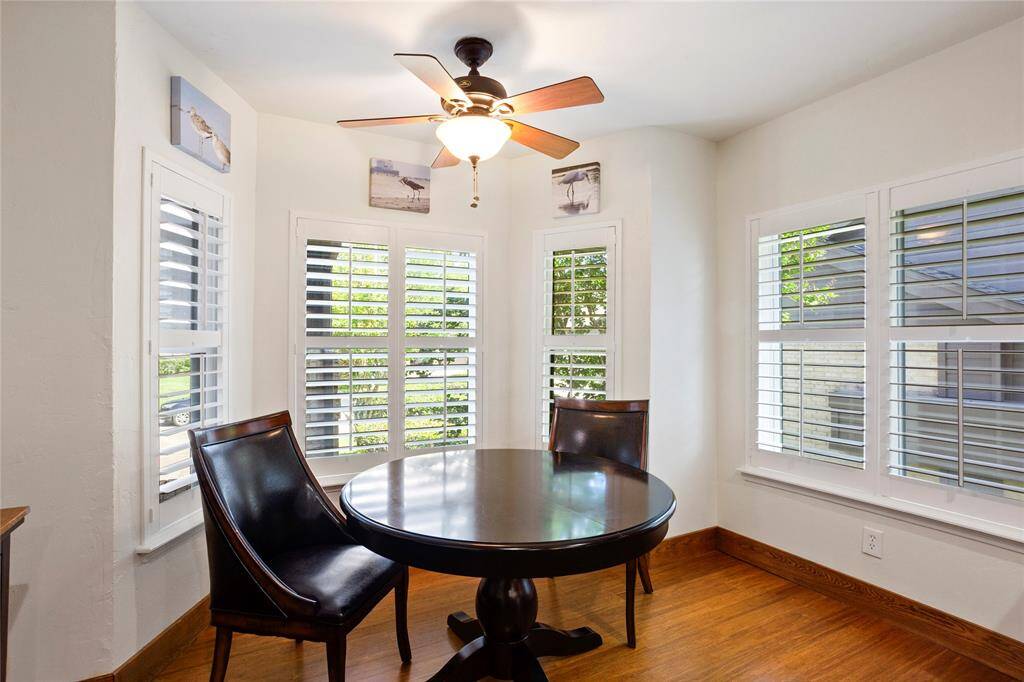Breakfast room has lots of natural light and plantation shutters.