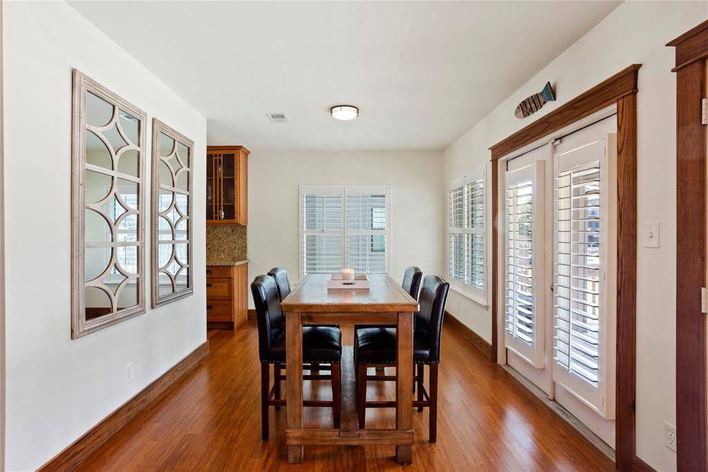 Formal dining room overlooking the balcony, with a canal view.