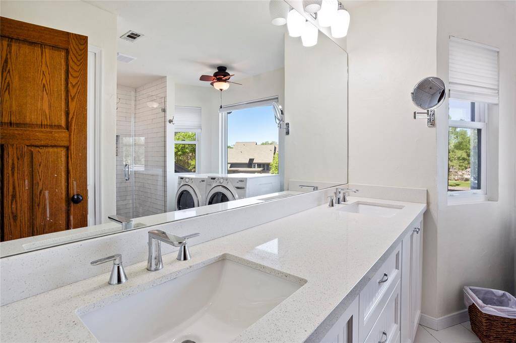 The primary bathroom was updated in 2023 with a new vanity and shower.